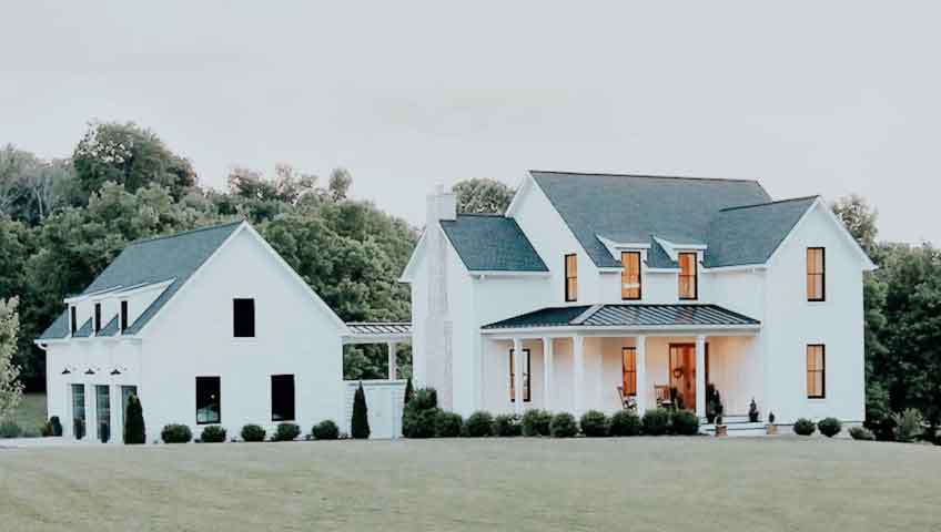What is modern farmhouse design? A mix of modern design elements and a comfortable, relaxed farmhouse aesthetic. Originating in Texas, the modern farmhouse is popular with interior design scenes in cities like Waco, Austin, and San Antonio, but has since spread to homes in major coastal cities! Overall, the classic farmhouse design is inspired by the look of a real barn or farmhouse and uses decorative elements that are charming, rustic and cozy throughout. But think of it this way with Modern Farmhouses: spaces inspired by modern farmhouses, with bright, contemporary design elements, but still with that warm vibe. Up until this point, you'll notice mid-century modern undertones in this style - but the basics are still definitely comfortable. What Is A Modern Farmhouse? The modern farmhouse is exactly what it sounds like: a modernized version of the classic farmhouse. But there’s much more than just mixing older and newer elements. The modern farmhouse is an excellent example of the farmhouse’s evolution, which is a style that has been around since early settlers arrived in the 1700s. Over the last several decades, the farmhouse has seen many variations, such as: Plantation Victorian Classical and Greek Revival Cracker Style Pennsylvania Dutch and Piedmont However, it always has the same key elements which all tie back to functionality: big, open spaces, clean lines, and a large porch. Most recently, in the late 2010s, the voguish yet country style that is of the modern farmhouse has skyrocketed in design choice. Modern Farmhouse Decor Special details are not just for furniture. Also pay attention to the details in the decor pieces to help this look really come to life. Modern Farmhouse spaces tend to go with industrial light fixtures to add a sculptural, architectural element. Along these lines, Modern Farmhouse decor places a strong emphasis on geometry in decorative details, from lights and mirrors to art and tabletop decor. These elements are extra conspicuous because of the minimal style approach that Modern Farmhouse interior design loves. Prefer Natural Materials When Designing a Farmhouse Modern Farmhouse has a dynamic mix of materials and textures. It's part of what makes this style so liveable—not to mention being kid and pet friendly. Natural materials and textures such as leather, natural wood, metal, stone, jute and linen are key to this look. And we definitely recommend mixing and matching a variety of natural textures! No matter what particular material you ride, it's all about tactile and visual texture. However, in addition to natural materials, you'll want to include unexpected materials like brass and velvet that add a modern twist to this style. Farmhouse Exterior Features Most modern farmhouses will have a clean, simple exterior—usually light, neutral sliding with large, open windows. While modern farmhouses are more about aesthetics than an architectural type, it's easy to spot one from the street. Some notable exterior features include: lots of windows Barn-style lighting, such as black-framed gas lamps large covered porch Black or gray gable roofs car style garage doors Farmhouse Interior Features Inside, you'll find plenty of space with rustic decor sprinkled throughout the house. Perfect for families of all sizes, there's no reason to sacrifice style for functionality. When it comes to the modern farmhouse, it's all about design. Here are some standard interior features: Natural wood and stone, such as exposed beams and wood furniture Farmhouse or large, open kitchen with apron sink Use of multiple shipyards or different items Shaker style cabinet wide plank floors Some decor items may include: Flipped or recycled materials Light color palette with dark accents Vintage and antique accessories Industrial, modern decor mixed with traditional, vintage pieces wood mixed with metal Write to us for comments and suggestions on modern farmhouse design.